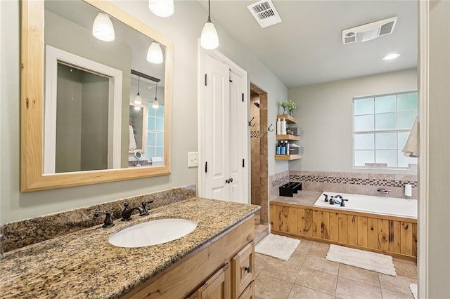 540 N 8th St, Ponchatoula, LA 70454 - full bathroom featuring vanity, a garden tub, and tile patterned floors