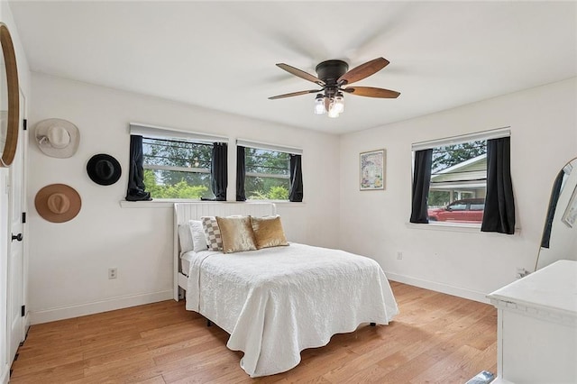540 N 8th St, Ponchatoula, LA 70454 - bedroom featuring multiple windows, light wood finished floors, and a ceiling fan