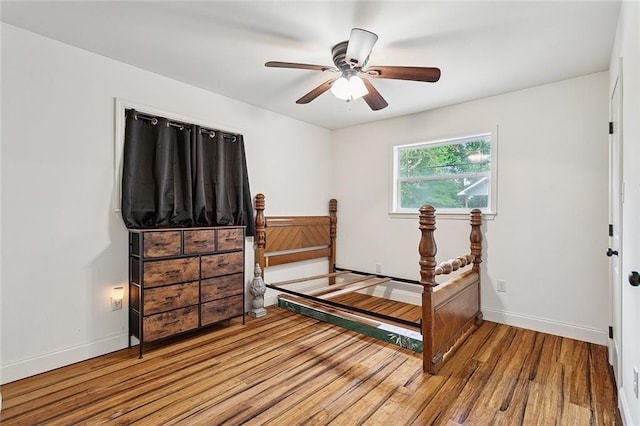 540 N 8th St, Ponchatoula, LA 70454 - bedroom with wood finished floors and a ceiling fan