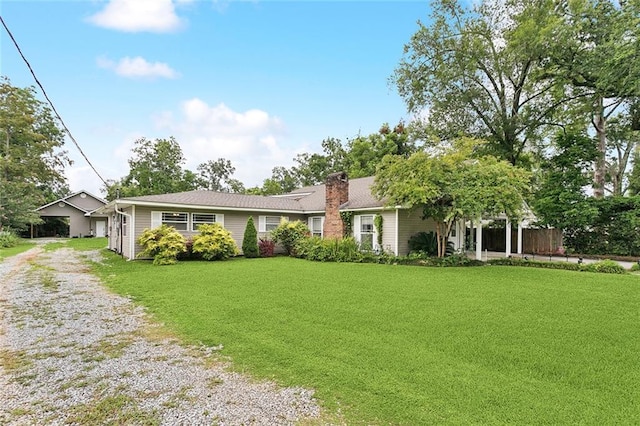 540 N 8th St, Ponchatoula, LA 70454 - ranch-style house with driveway, a front yard, and a chimney