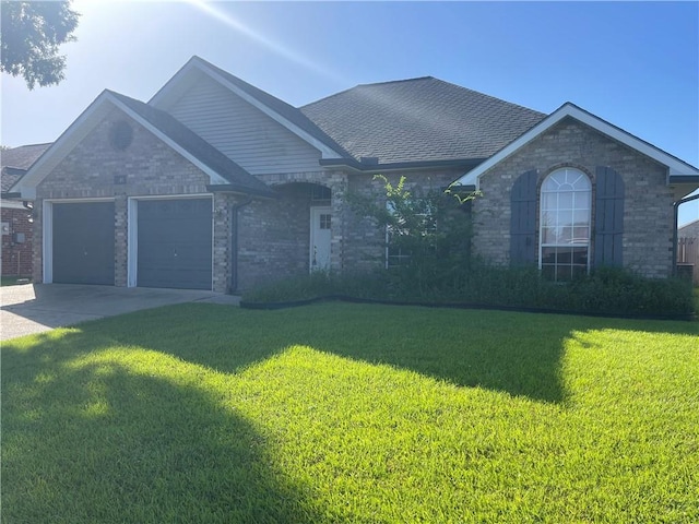 40 Cane Dr, La Place, LA 70068 - ranch-style house with brick siding, a front lawn, a garage, and driveway
