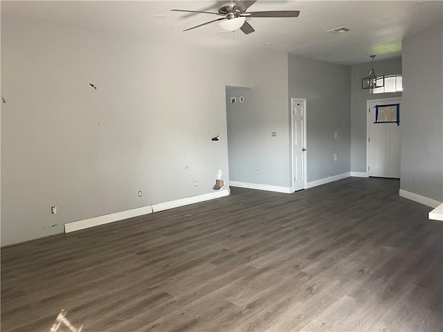 40 Cane Dr, La Place, LA 70068 - unfurnished living room with a ceiling fan, a chandelier, and dark wood-type flooring
