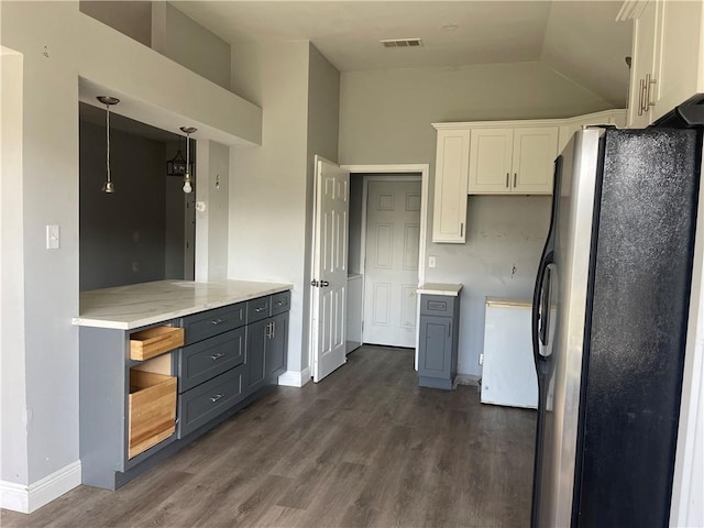 40 Cane Dr, La Place, LA 70068 - kitchen with freestanding refrigerator, lofted ceiling, dark wood-type flooring, gray cabinetry, and white cabinets