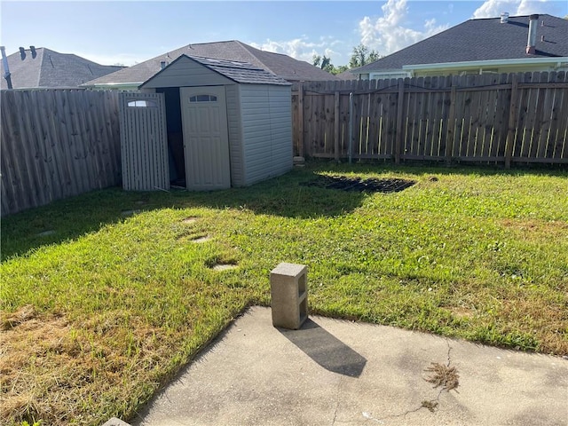 40 Cane Dr, La Place, LA 70068 - fenced backyard with a storage unit