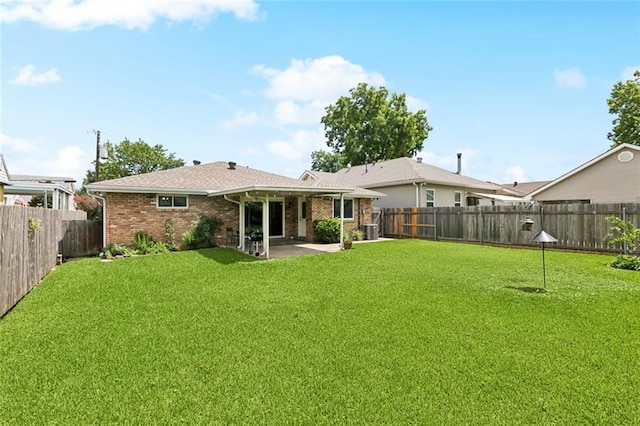 3514 Bore St, Metairie, LA 70001 - rear view of property featuring a patio, a fenced backyard, brick siding, and roof with shingles