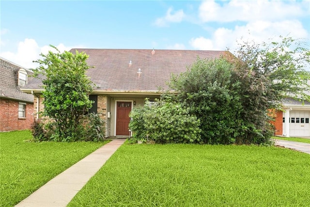 2608 Hyman Pl, New Orleans, LA 70131 - view of front of home featuring a front yard, brick siding, and a shingled roof