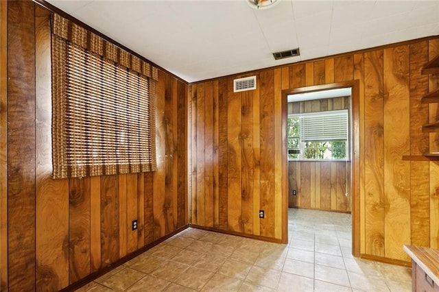 2608 Hyman Pl, New Orleans, LA 70131 - empty room featuring wooden walls and light tile patterned floors