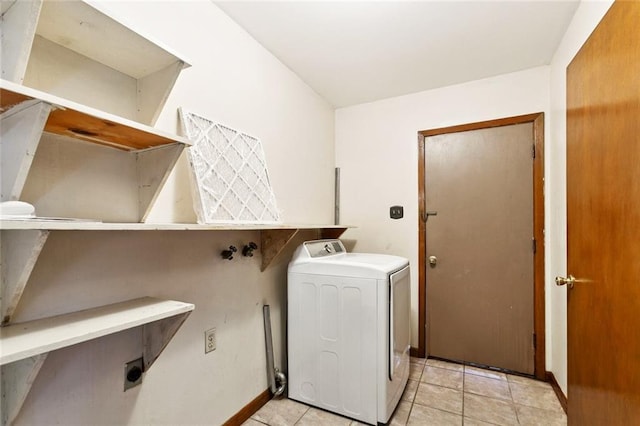 2608 Hyman Pl, New Orleans, LA 70131 - washroom with washer / dryer and light tile patterned floors