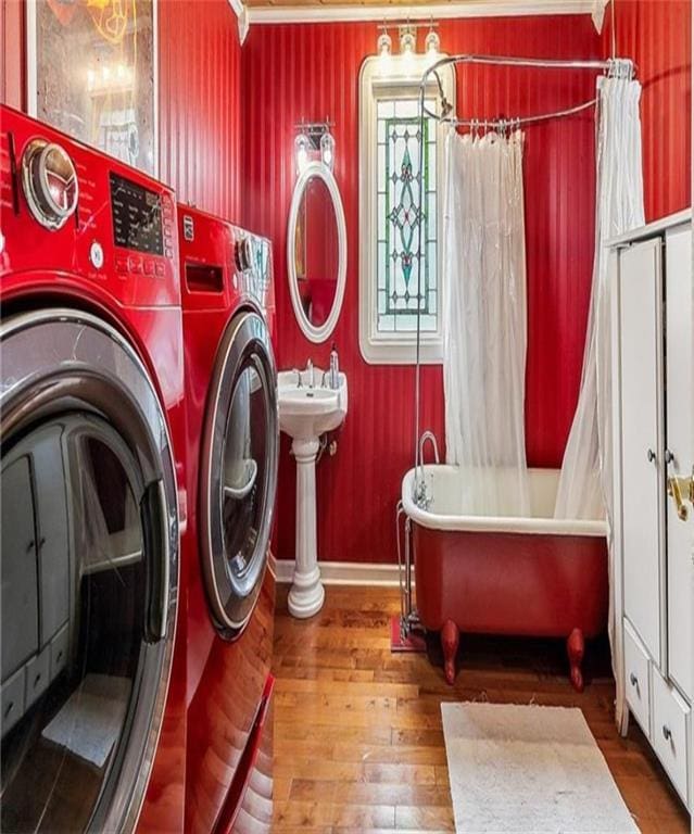 3821 Derbigny St, Metairie, LA 70001 - laundry area featuring washer and dryer, hardwood / wood-style floors, and ornamental molding