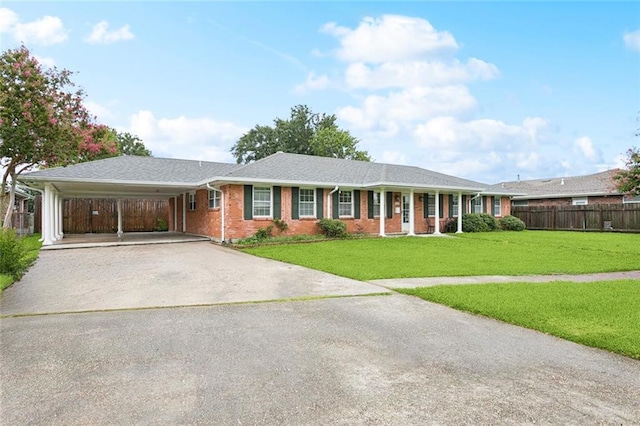 4827 Utica St, Metairie, LA 70006 - ranch-style house featuring driveway, a carport, and brick siding