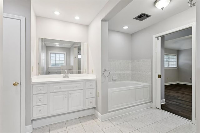 4827 Utica St, Metairie, LA 70006 - bathroom with a bath, vanity, tile patterned flooring, and healthy amount of natural light