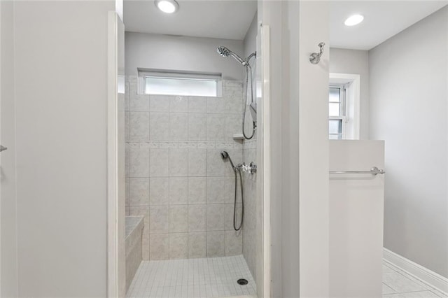 4827 Utica St, Metairie, LA 70006 - bathroom featuring tiled shower and tile patterned flooring