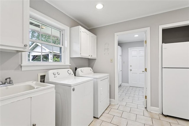 4827 Utica St, Metairie, LA 70006 - laundry area with cabinet space, separate washer and dryer, light tile patterned floors, recessed lighting, and ornamental molding
