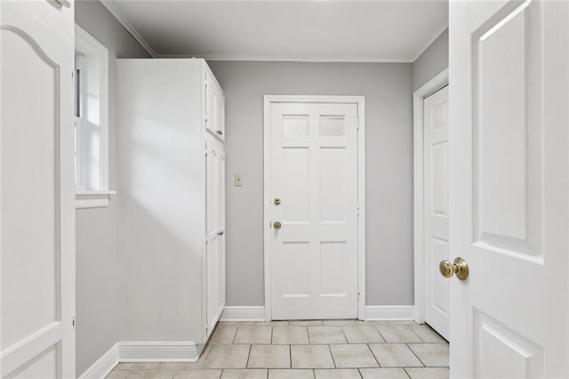 4827 Utica St, Metairie, LA 70006 - entryway with light tile patterned flooring and crown molding