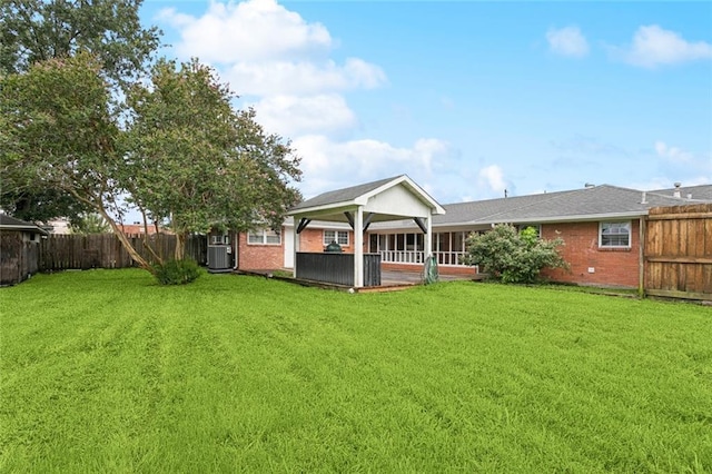 4827 Utica St, Metairie, LA 70006 - rear view of house featuring a fenced backyard and brick siding