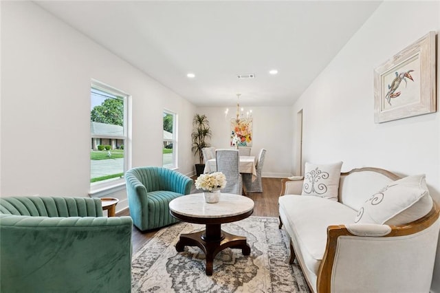 1109 Manson St, Metairie, LA 70001 - living area featuring a chandelier, wood finished floors, and recessed lighting