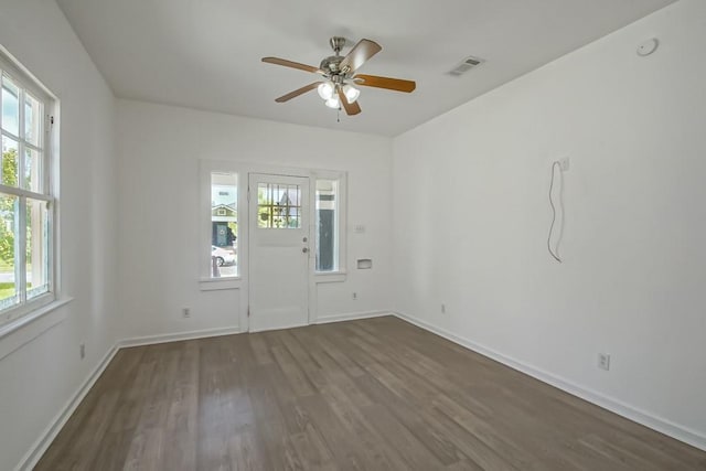 425 Park Blvd, New Orleans, LA 70114 - empty room with dark wood-style flooring, plenty of natural light, and a ceiling fan
