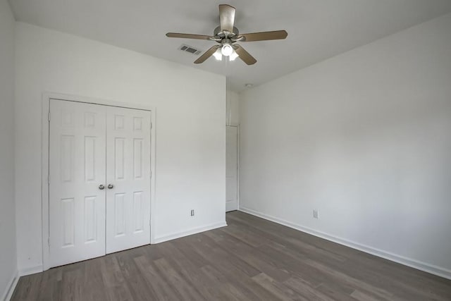 425 Park Blvd, New Orleans, LA 70114 - unfurnished bedroom with dark wood-type flooring, a closet, and a ceiling fan