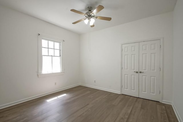 425 Park Blvd, New Orleans, LA 70114 - unfurnished bedroom featuring dark wood-style floors, a closet, and a ceiling fan