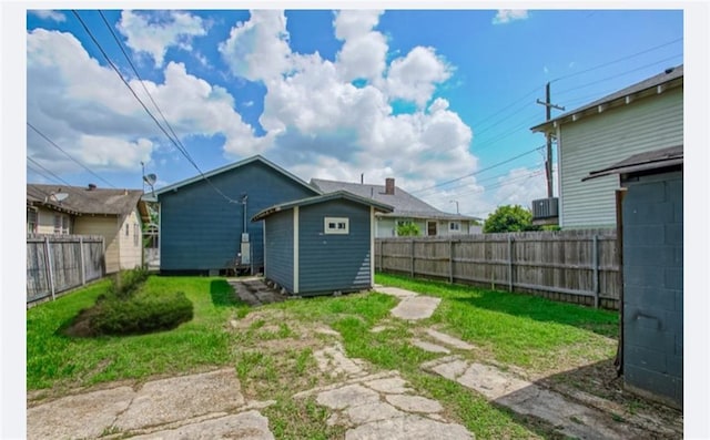 425 Park Blvd, New Orleans, LA 70114 - back of house with a storage unit and a fenced backyard