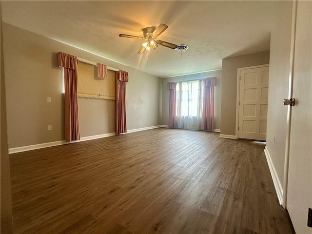 8732 25th St, Metairie, LA 70003 - unfurnished bedroom featuring dark wood-type flooring and a ceiling fan