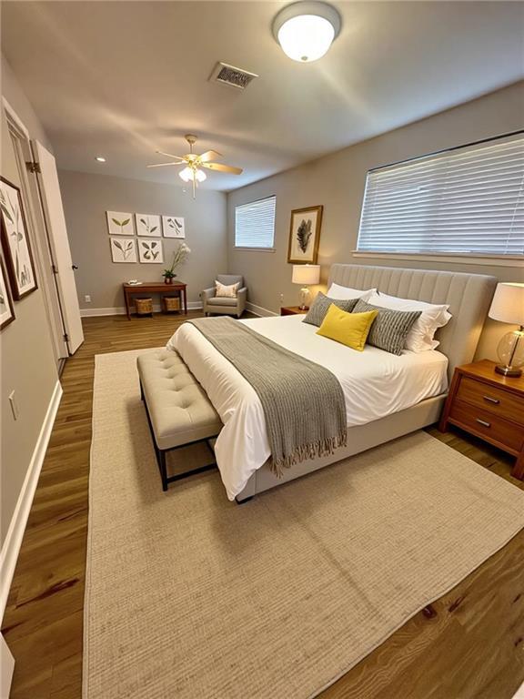8732 25th St, Metairie, LA 70003 - bedroom with wood finished floors and ceiling fan