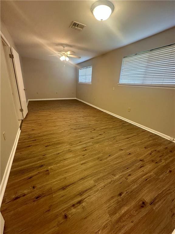 8732 25th St, Metairie, LA 70003 - unfurnished bedroom with dark wood-style flooring and baseboards