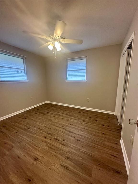 8732 25th St, Metairie, LA 70003 - unfurnished bedroom featuring multiple windows, wood finished floors, and a closet