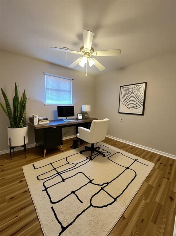 8732 25th St, Metairie, LA 70003 - home office with wood finished floors and ceiling fan