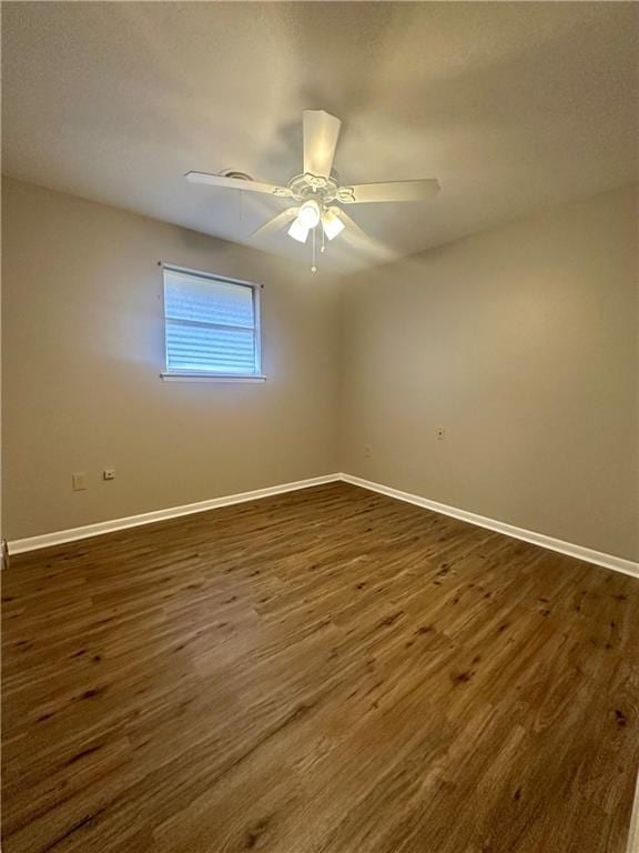 8732 25th St, Metairie, LA 70003 - spare room featuring dark wood-style floors and ceiling fan