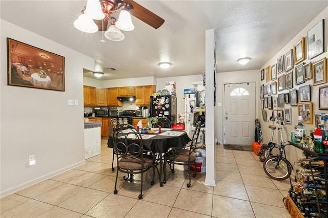 484951 Viola St, New Orleans, LA 70126 - dining area featuring light tile patterned floors and ceiling fan
