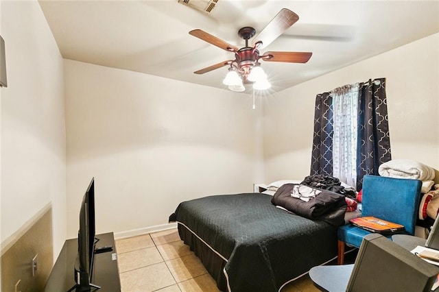 484951 Viola St, New Orleans, LA 70126 - bedroom with light tile patterned floors and ceiling fan