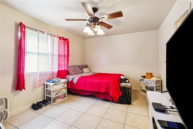 484951 Viola St, New Orleans, LA 70126 - bedroom featuring light tile patterned floors and ceiling fan