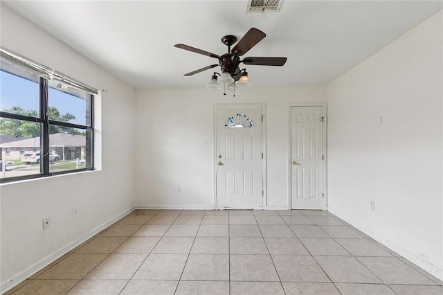 484951 Viola St, New Orleans, LA 70126 - foyer entrance featuring a ceiling fan and light tile patterned flooring