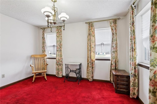 3125 Metairie Ct, Metairie, LA 70002 - sitting room featuring carpet flooring, a chandelier, and a textured ceiling