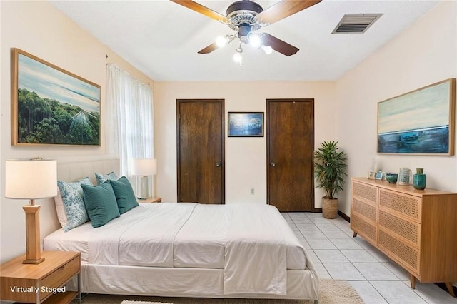 3125 Metairie Ct, Metairie, LA 70002 - bedroom featuring light tile patterned floors, multiple closets, and ceiling fan