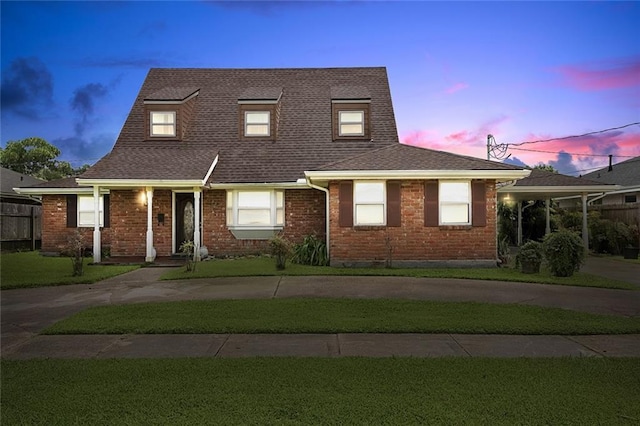 3125 Metairie Ct, Metairie, LA 70002 - view of front facade with roof with shingles, a front yard, and brick siding