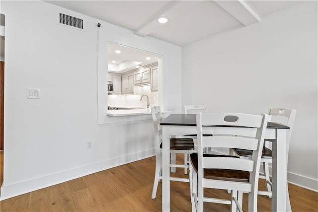 300 Lake Marina Ave Unit 7-C, New Orleans, LA 70124 - dining area with wood finished floors and recessed lighting