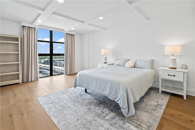 300 Lake Marina Ave Unit 7-C, New Orleans, LA 70124 - bedroom with coffered ceiling, light wood-type flooring, beam ceiling, and recessed lighting