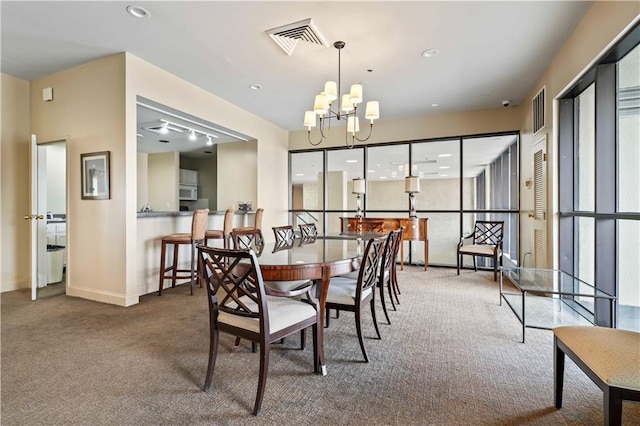 300 Lake Marina Ave Unit 7-C, New Orleans, LA 70124 - carpeted dining area with a chandelier and recessed lighting