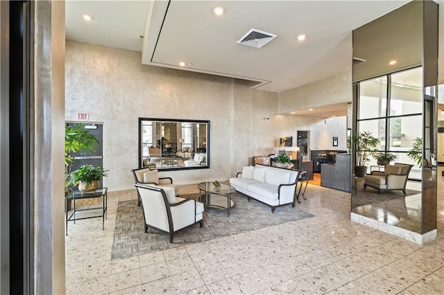 300 Lake Marina Ave Unit 7-C, New Orleans, LA 70124 - community lobby featuring a towering ceiling and recessed lighting