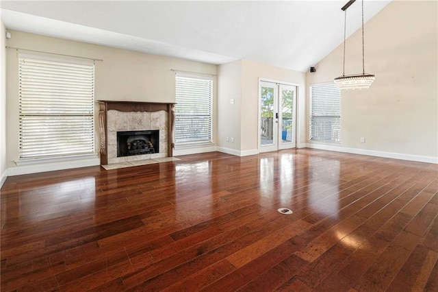 26 Chamale Cv Unit 26, Slidell, LA 70460 - unfurnished living room with wood finished floors, a premium fireplace, and high vaulted ceiling