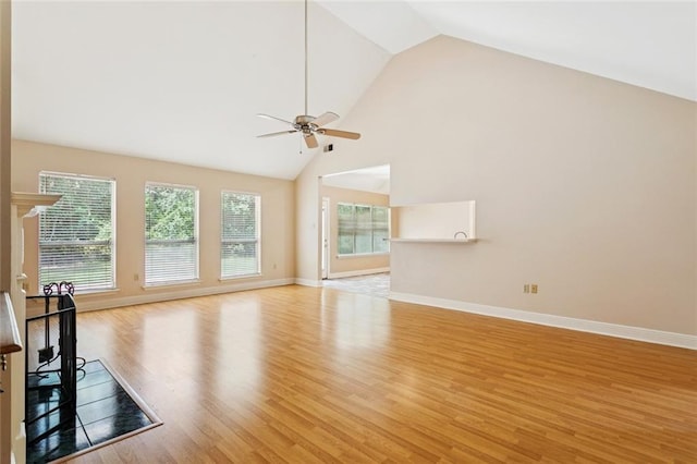 418 Westwood Dr, Mandeville, LA 70471 - unfurnished living room featuring a ceiling fan, light wood-type flooring, and high vaulted ceiling