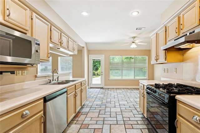 418 Westwood Dr, Mandeville, LA 70471 - kitchen with stainless steel appliances, under cabinet range hood, a ceiling fan, light countertops, and light brown cabinetry