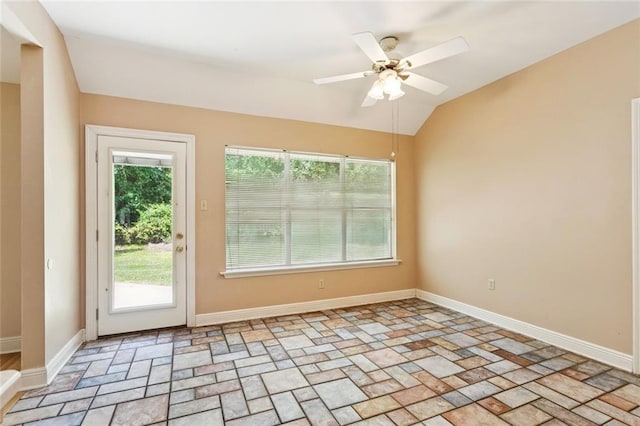 418 Westwood Dr, Mandeville, LA 70471 - unfurnished room with stone tile flooring, ceiling fan, and vaulted ceiling