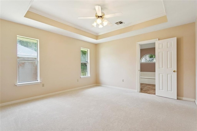 418 Westwood Dr, Mandeville, LA 70471 - carpeted spare room with crown molding, a tray ceiling, and ceiling fan