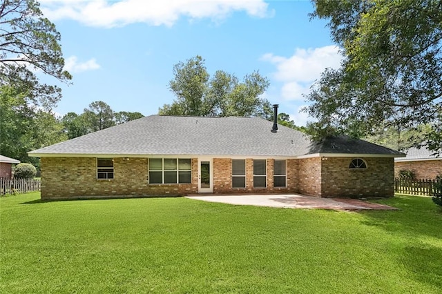 418 Westwood Dr, Mandeville, LA 70471 - back of property featuring a patio area, brick siding, and roof with shingles