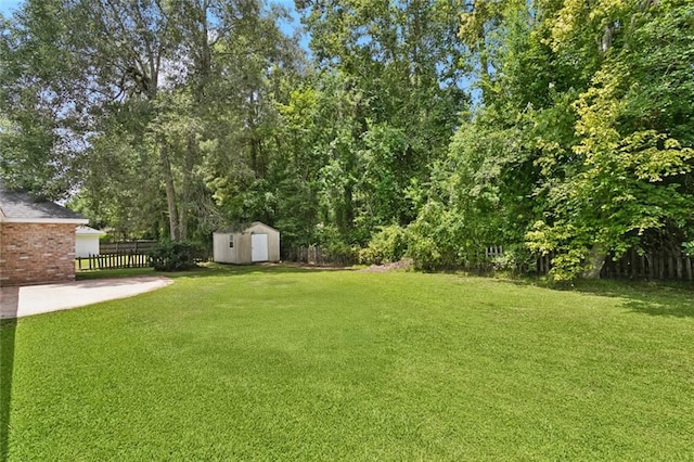 418 Westwood Dr, Mandeville, LA 70471 - view of yard with a shed and a patio
