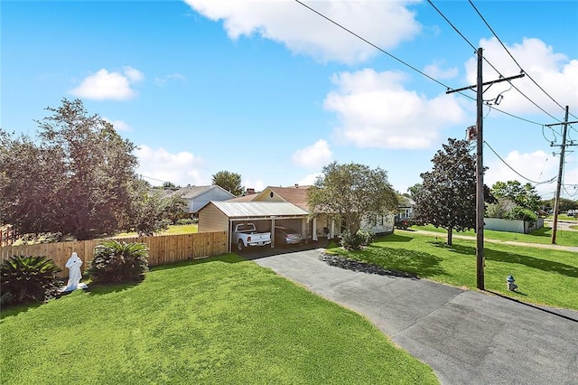 1929 Jean Lafitte Blvd, Lafitte, LA 70067 - view of front of home featuring driveway and an attached carport