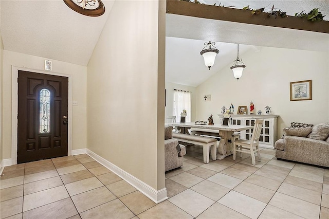 1929 Jean Lafitte Blvd, Lafitte, LA 70067 - foyer entrance featuring light tile patterned flooring, plenty of natural light, and high vaulted ceiling
